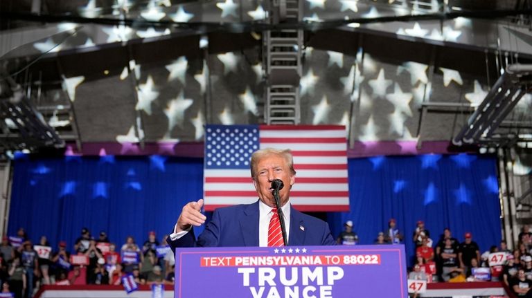 Republican presidential nominee former President Donald Trump speaks at a...