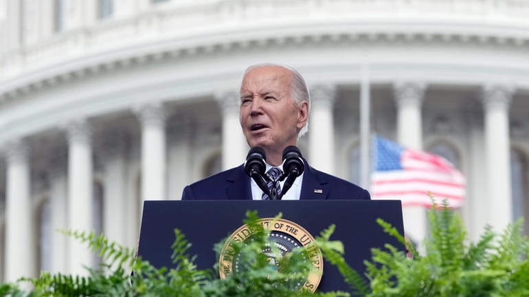 President Joe Biden speaks during a memorial service to honor...