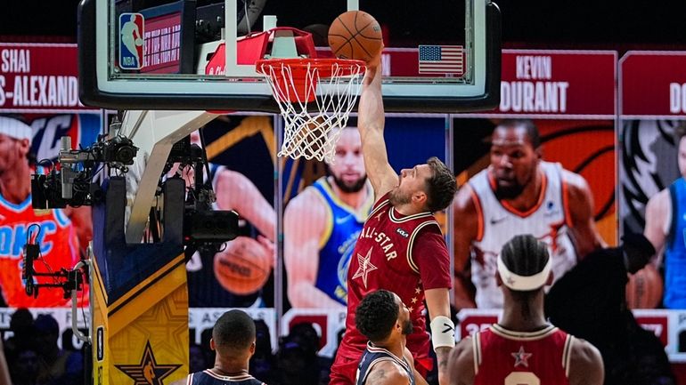 Dallas Mavericks guard Luka Doncic (77) get a basket on...