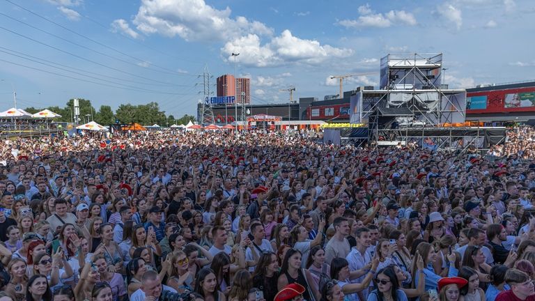 People enjoy a concert at the Atlas Festival in Kyiv,...