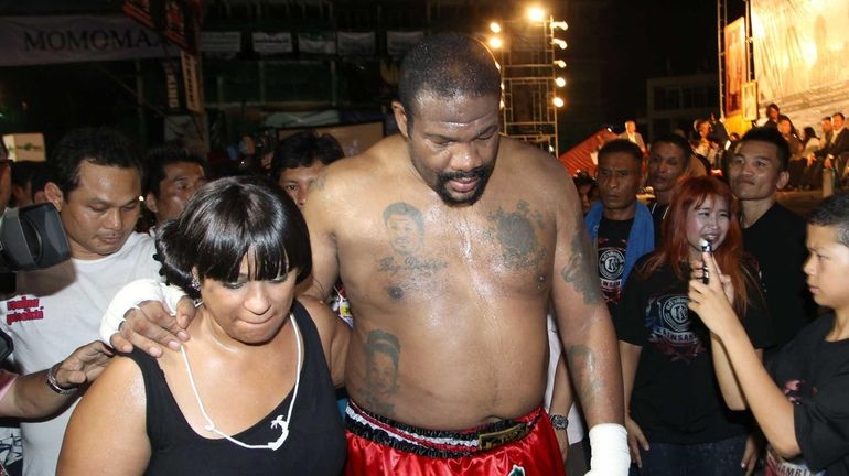 Former heavyweight boxing champion Riddick Bowe of the U.S., right,...