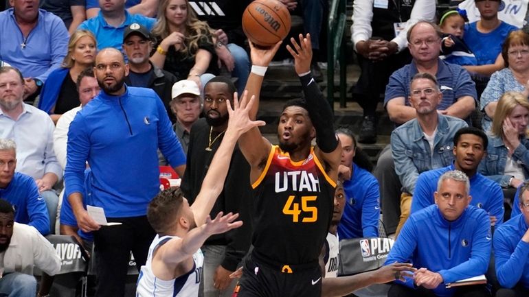 Dallas Mavericks forward Maxi Kleber, left, defends as Utah Jazz...