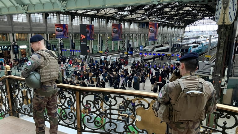 Soldiers patrol inside the Gare de Lyon station after an...