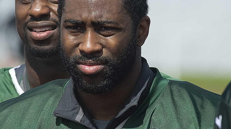 Darrelle Revis leaves the field after Jets training camp at...