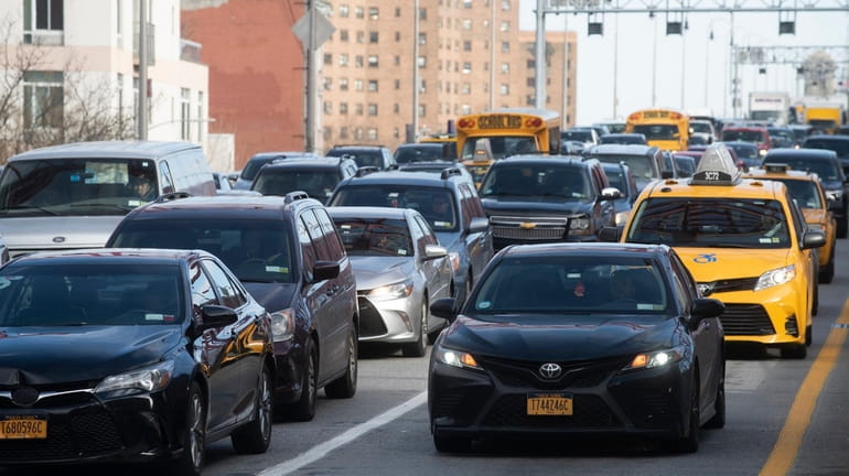 Vehicles arrive in Manhattan after crossing the Williamsburg Bridge, Manhattan...