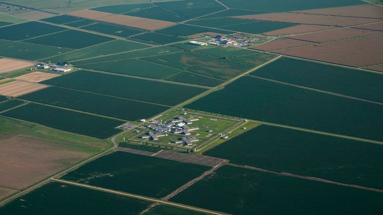 In this aerial photo, a cell block and agricultural fields...