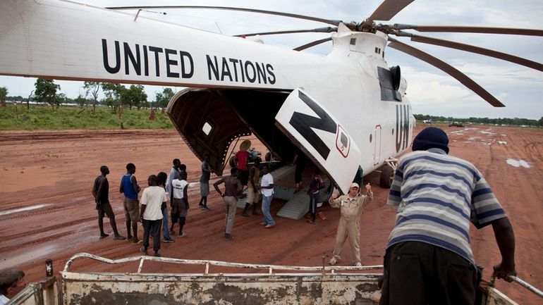 FILE -A World Food Programme (WFP) truck backs up to...