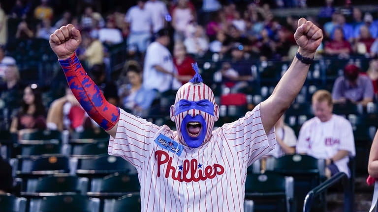 A Philadelphia Phillies fan celebrates before Game 3 of the...