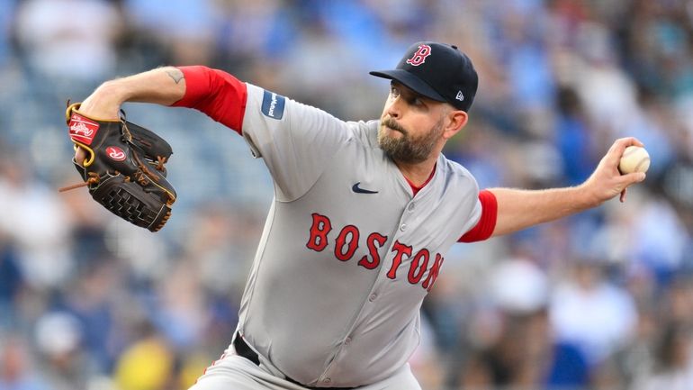 Boston Red Sox starting pitcher James Paxton throws to a...