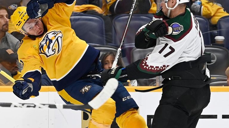 Arizona Coyotes center Nick Bjugstad (17) checks Nashville Predators defenseman...