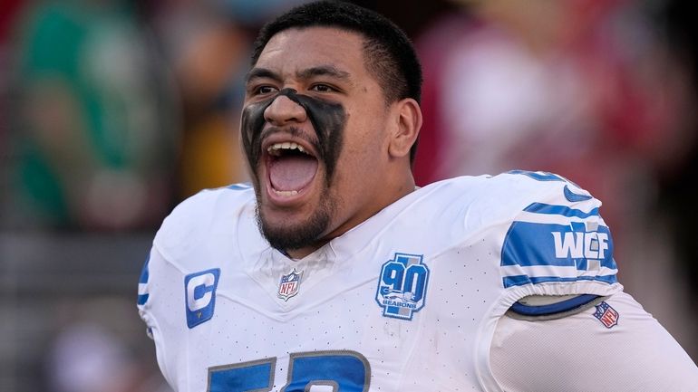 Detroit Lions offensive tackle Penei Sewell takes the field before...