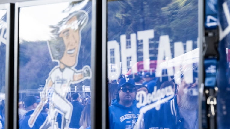 Los Angeles Dodgers fans shop for merchandise during the team's...