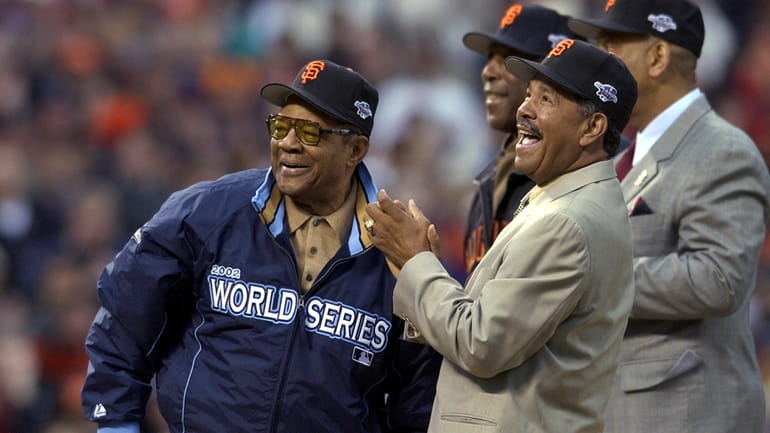 Willie Mays, left, is joined by former San Francisco Giants'...