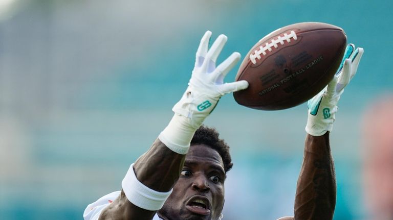 Miami Dolphins wide receiver Tyreek Hill (10) catches a pass...