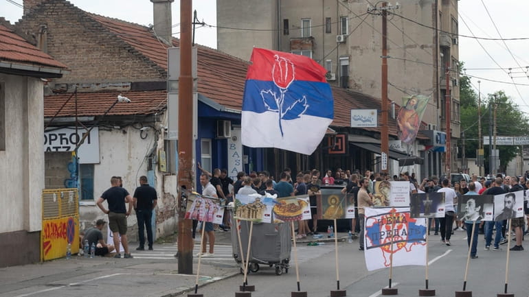 Right-wing extremists gather on a street in central Belgrade, Serbia,...