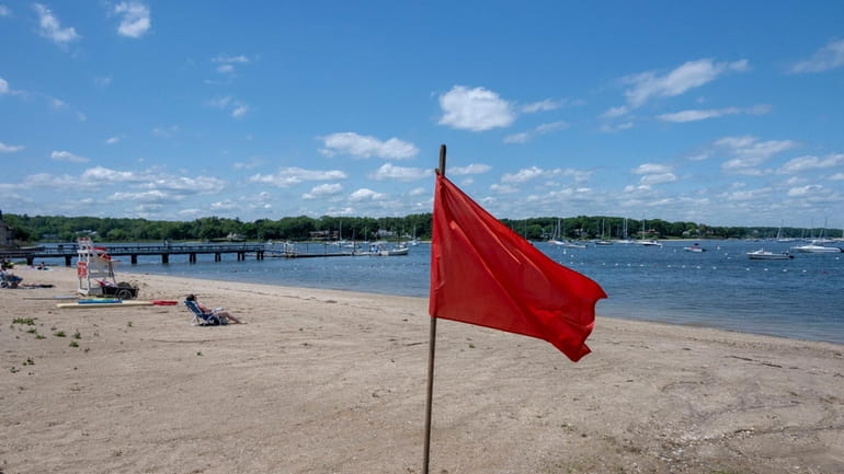 A beach in Huntington closed because of high bacteria counts from heavy rainfall.