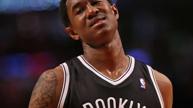 MarShon Brooks of the Brooklyn Nets walks off the court...