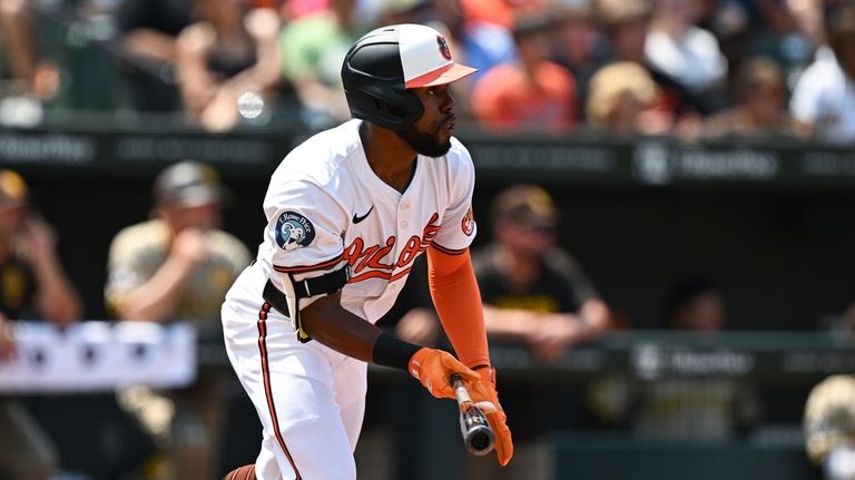 Baltimore Orioles' Cedric Mullins runs after hitting a two-run double...