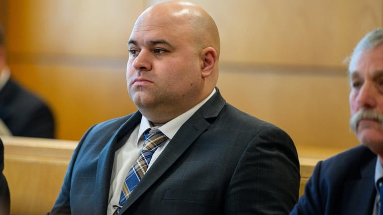 Southold ex-probationary cop Garrett Lake during his trial in Suffolk...