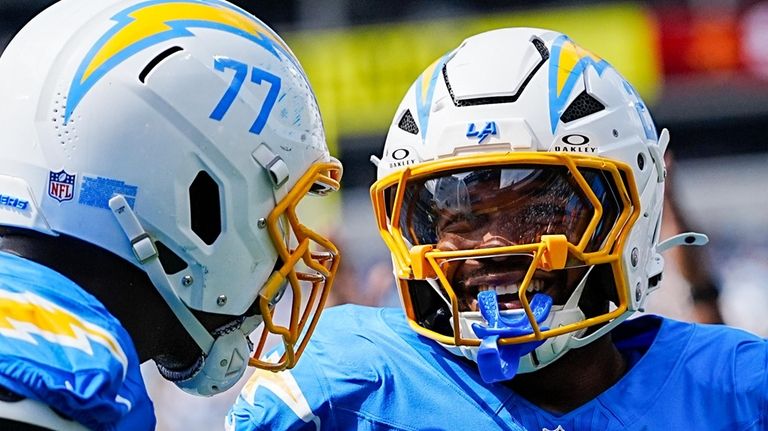 Los Angeles Chargers cornerback Shaun Wade celebrates after scoring guard...