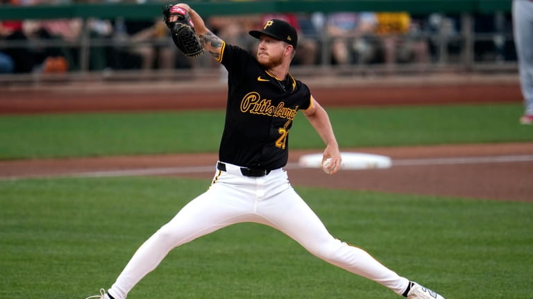 Pittsburgh Pirates starting pitcher Bailey Falter delivers to a Cincinnati...