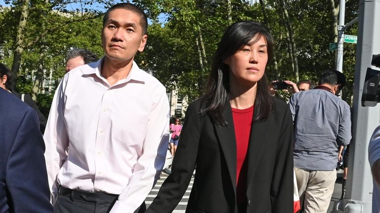 Linda Sun and her husband, Chris Hu, leave Brooklyn Federal Court...