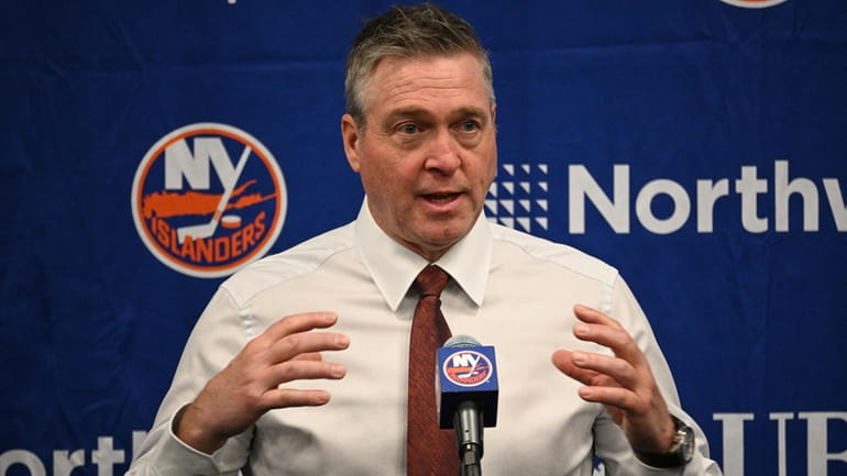 Islanders head coach Patrick Roy talks to the media after...