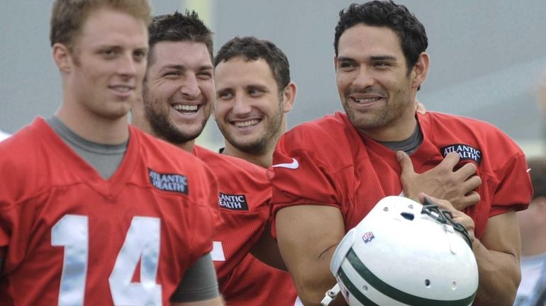 New York Jets quarterbacks Greg McElroy #14, G.J. Kinne #7,...