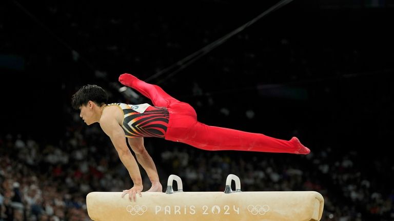 Daiki Hashimoto, of Japan, pommel during the men's artistic gymnastics...