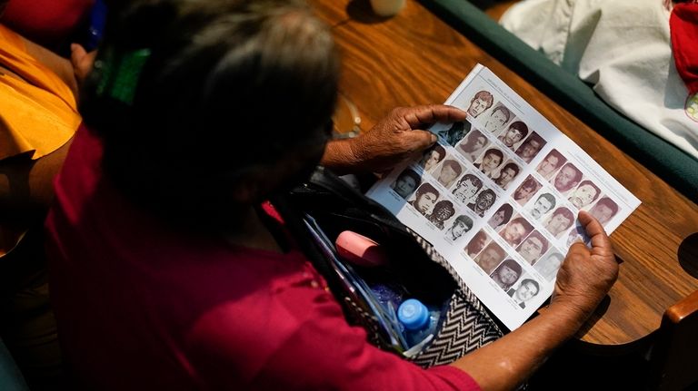 Photos of missing people fill a report by the Guerrero...