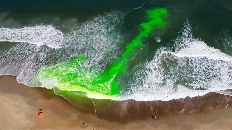 This image provided by NOAA, pictures a harmless green dye...