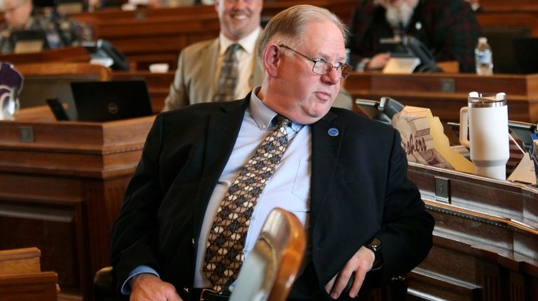 Kansas House Speaker Dan Hawkins, R-Wichita, turns to talk to...