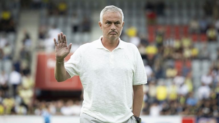 Fenerbahce's head coach Jose Mourinho waves before a UEFA Champions...