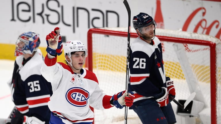Montreal Canadiens left wing Juraj Slafkovsky (20) celebrates his goal...