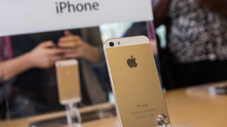 The gold version of the iPhone 5S is displayed at...