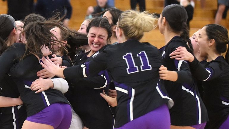 Port Jefferson teammates celebrate after their 3-0 win over East...