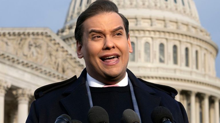 Rep. George Santos, R-N.Y., faces reporters at the Capitol, Nov....