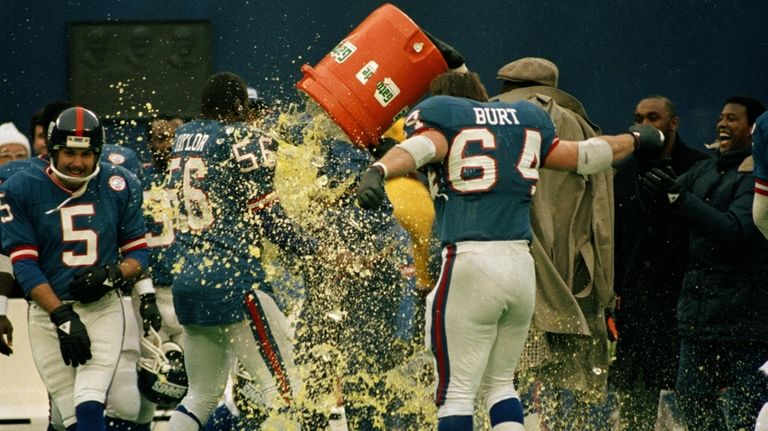 Giants head coach Bill Parcells is doused with Gatorade by...