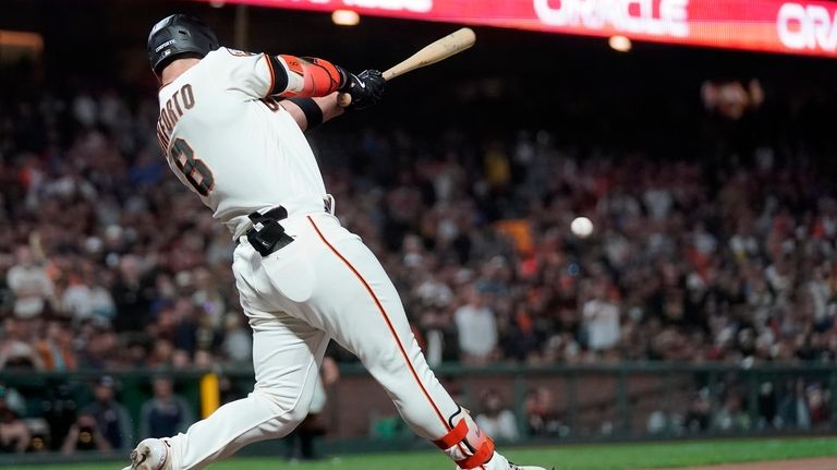 San Francisco Giants' Michael Conforto hits a two-run single against...