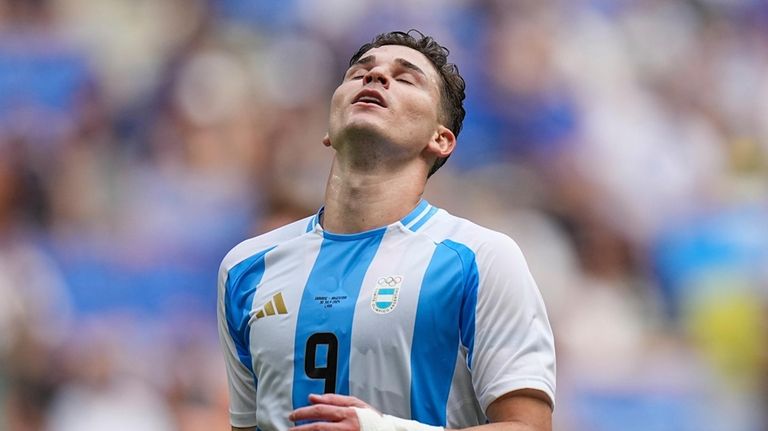 Argentina's Julian Alvarez gestures during the men's Group B soccer...