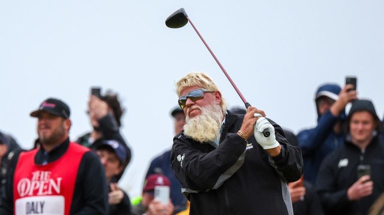 John Daly hits off the sixth tee during his opening...