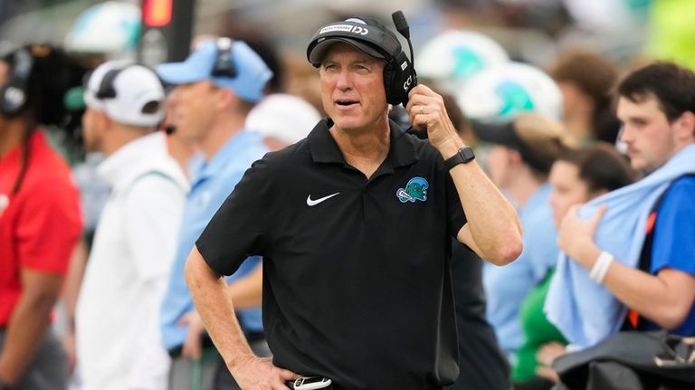 Tulane head coach Willie Fritz watches from the sideline during...