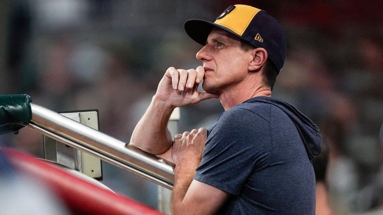 FILE -Milwaukee Brewers manager Craig Counsell watches from the dugout...