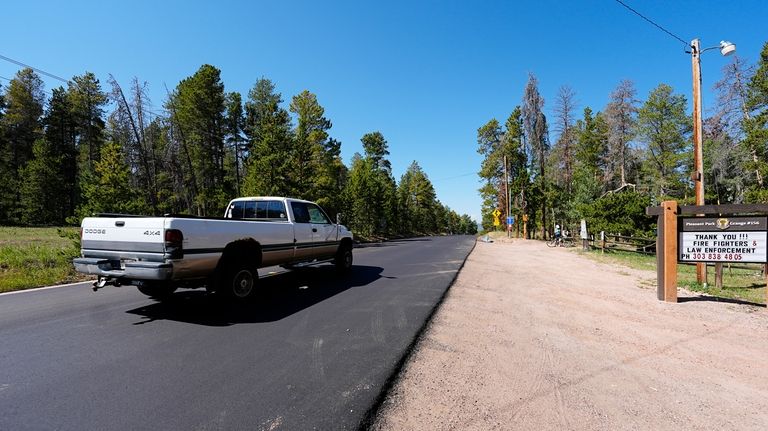 A pickup truck moves along the 23000 block of Pleasant...