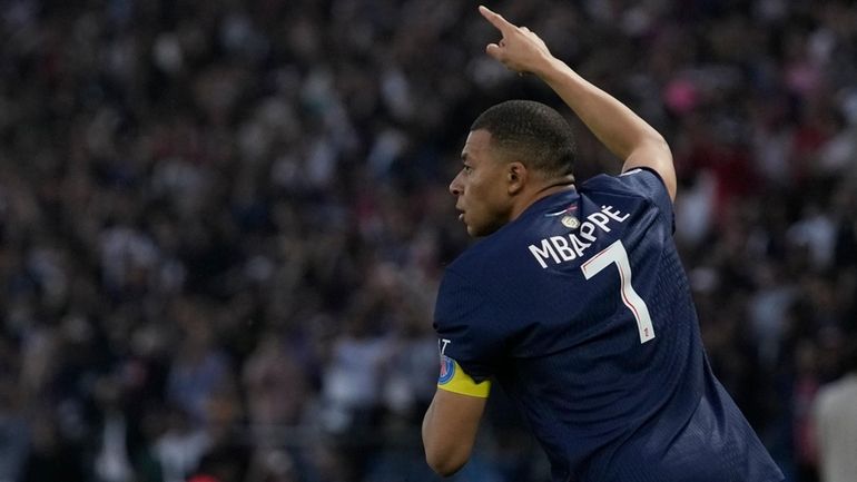 PSG's Kylian Mbappe celebrates after scoring his side's opening goal...