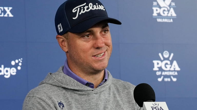 Justin Thomas speaks during a news conference at the PGA...