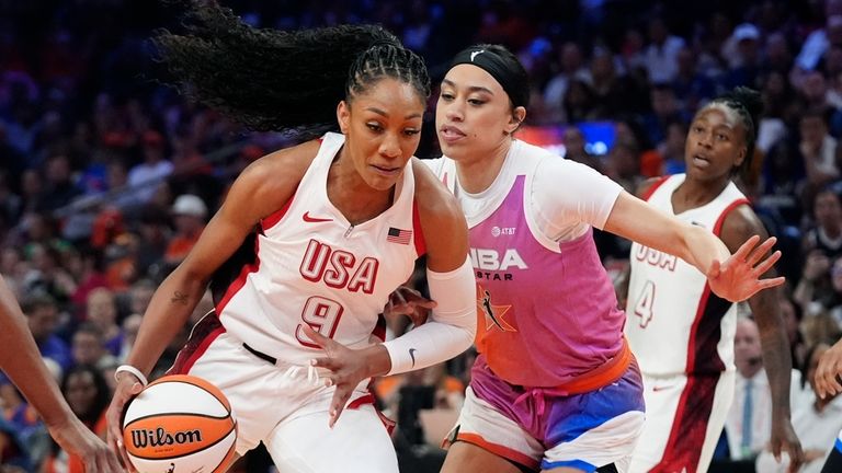 A'ja Wilson (9), of Team USA, drives past Dearica Hamby,...