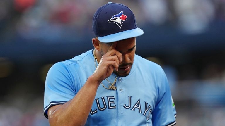 Toronto Blue Jays pitcher Jose Berrios reacts at the end...