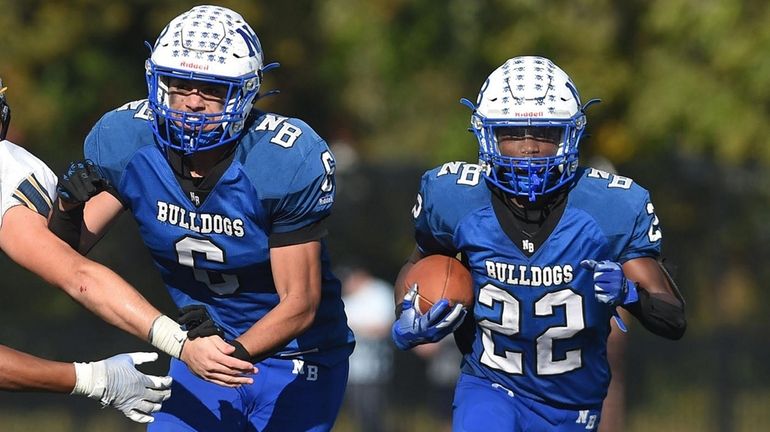 Jawara Keahey of North Babylon, right, finds daylight with help...