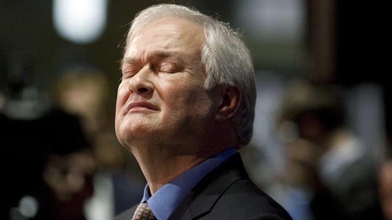 NHL Players' Association executive director Donald Fehr reacts to a...